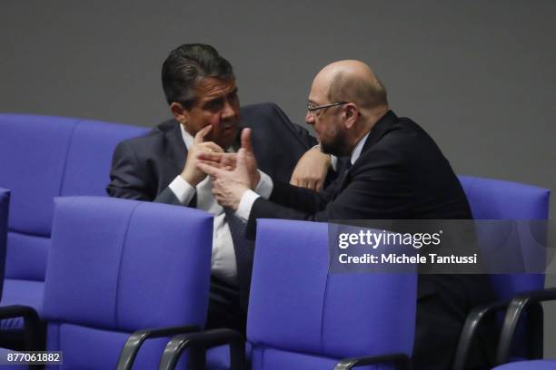 Sigmar Gabriel, Germany's foreign minister speaks with Martin Schulz, leader of the Social Democrats Party or during the first session of the...