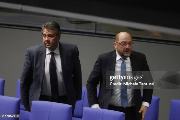 Sigmar Gabriel, Germany's foreign minister speaks with Martin Schulz, leader of the Social Democrats Party or during the first session of the...