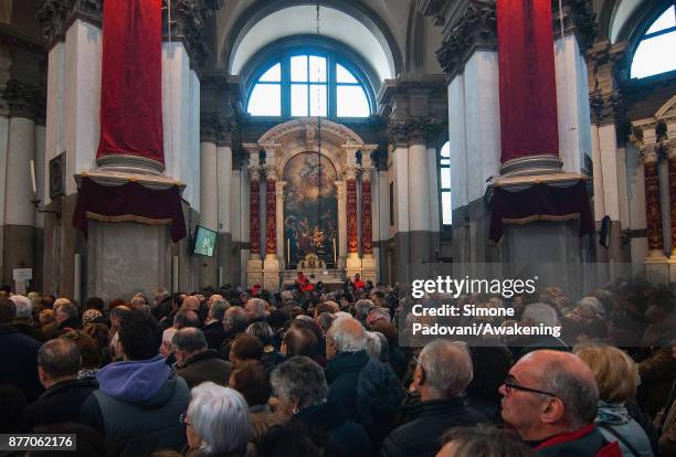 Pilgrims attend at the holy mass at Madonna della Salute church on the day of the traditional Festa della Salute on November 21, 2017 in Venice,...