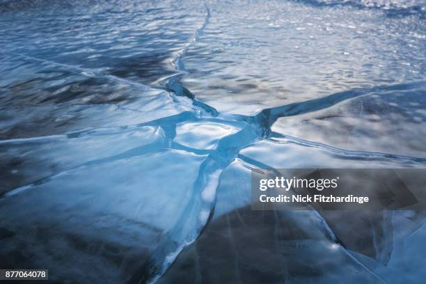 a frozen ice pattern on abraham lake, kootenay plains, alberta, canada - broken ice stock pictures, royalty-free photos & images