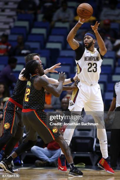 Anthony Davis of the New Orleans Pelicans drives against Luke Babbitt of the Atlanta Hawks during the first half of a game at the Smoothie King...