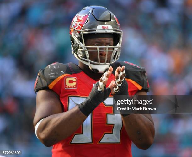 Gerald McCoy of the Tampa Bay Buccaneers celebrates Salute to Service during the third quarter against the Miami Dolphins at Hard Rock Stadium on...