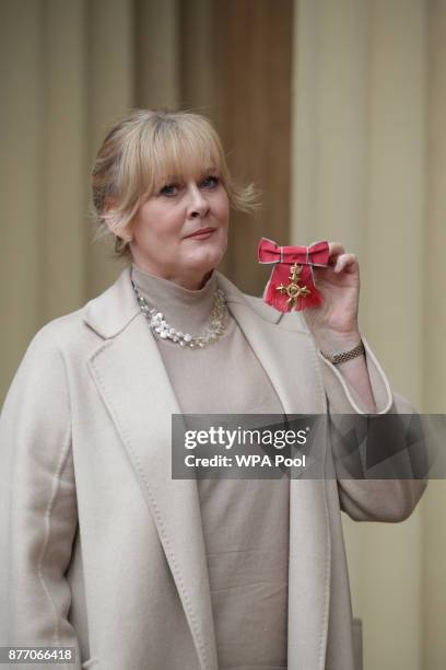 Actress Sarah Lancashire poses after she was awarded an OBE by Duke of Cambridge during an Investiture ceremony at Buckingham Palace on November 21,...