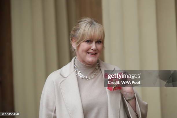 Actress Sarah Lancashire poses after she was awarded an OBE by Duke of Cambridge during an Investiture ceremony at Buckingham Palace on November 21,...