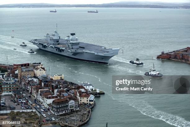 Queen Elizabeth sails into her home port of Portsmouth Naval Base following sea trials and ahead of being formally commissioned into the Royal Navy...