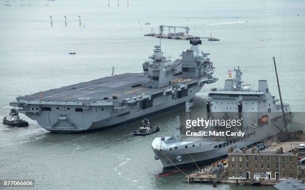 Queen Elizabeth sails into her home port of Portsmouth Naval Base following sea trials and ahead of being formally commissioned into the Royal Navy...