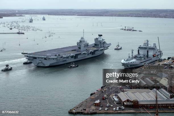 Queen Elizabeth sails into her home port of Portsmouth Naval Base following sea trials and ahead of being formally commissioned into the Royal Navy...