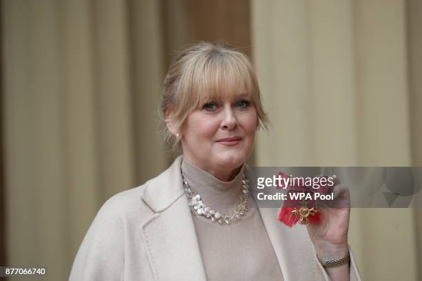 Actress Sarah Lancashire poses after she was awarded an OBE by Duke of Cambridge during an Investiture ceremony at Buckingham Palace on November 21,...
