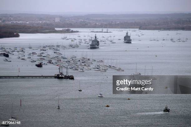 Boats are pictured near Portsmouth dockyard, on November 21, 2017 in Portsmouth, England. HMS Queen Elizabeth is the lead ship in the new Queen...
