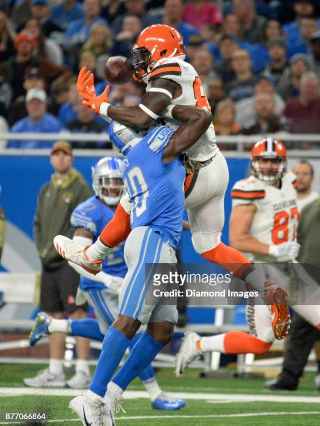 Pass hits the face of tight end David Njoku of the Cleveland Browns, as he is defended by linebacker Jarrad Davis of the Detroit Lions in the first...