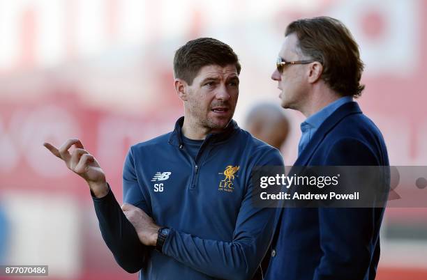 Steven Gerrard manager of Liverpool U19 talking with ex Liverpool player Steve McManaman before the UEFA Champions League group E match between...