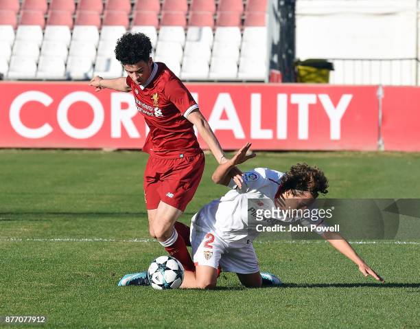 Curtis Jones of Liverpool U19 competes with Valentino Fattore Scotta of Sevilla FC U19 during the UEFA Champions League group E match between Sevilla...