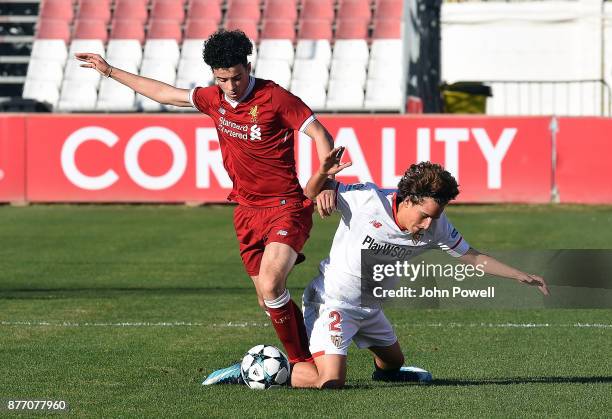 Curtis Jones of Liverpool U19 competes with Valentino Fattore Scotta of Sevilla FC U19 during the UEFA Champions League group E match between Sevilla...