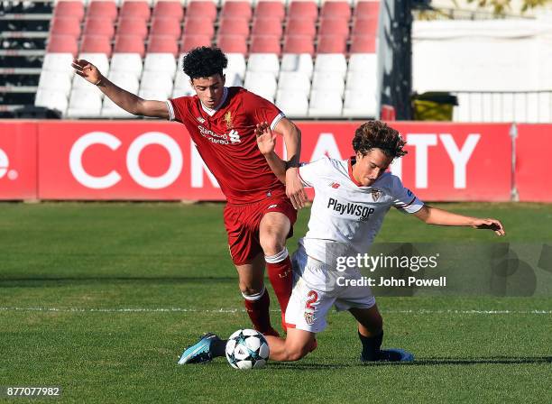 Curtis Jones of Liverpool U19 competes with Valentino Fattore Scotta of Sevilla FC U19 during the UEFA Champions League group E match between Sevilla...