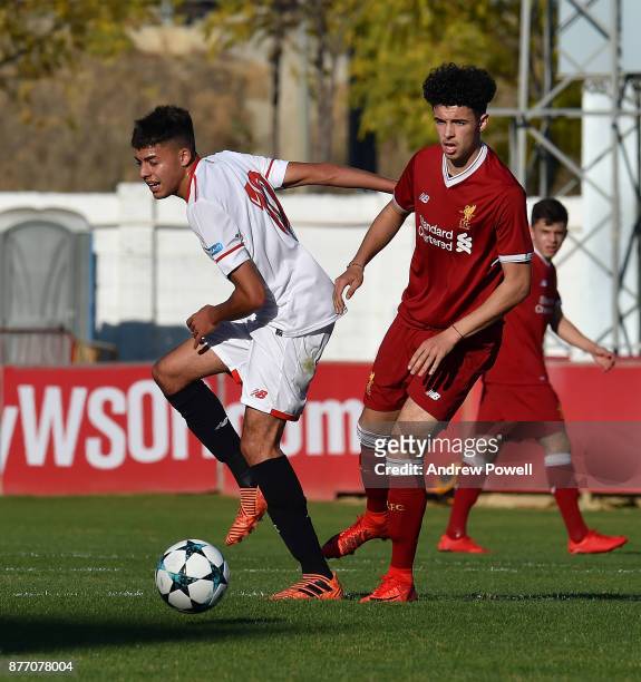 Curtis Jones of Liverpool U19 competes with Charaf of Sevilla FC U19 during the UEFA Champions League group E match between Sevilla FC U19 and...