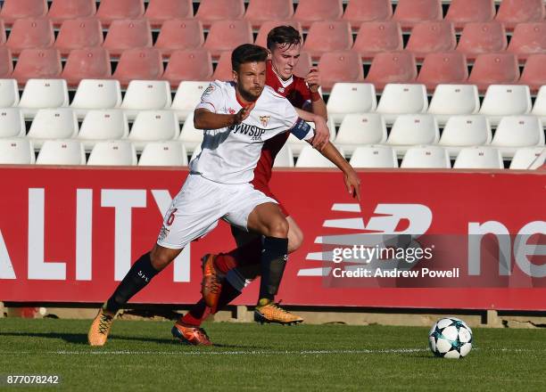 Liam Millar of Liverpool U19 competes with Josema of Sevilla FC U19 during the UEFA Champions League group E match between Sevilla FC U19 and...