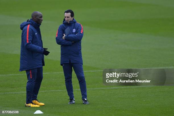 Paris Saint-Germain Head Coach Unai Emery speaks with Zoumana Camara during warm up before a Paris Saint-Germain training session at Centre Ooredoo...