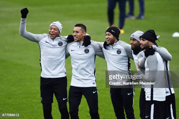 Kylian Mbappe, Marquinhos, Neymar Jr, Lucas and Layvin Kurzawa react during a Paris Saint-Germain training session at Centre Ooredoo on November 21,...