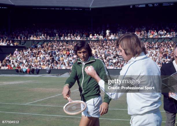 Doubles partners Ilie Nastase of Romania and Jimmy Connors of the USA walk on to the court during the Wimbledon Lawn Tennis Championships at the All...