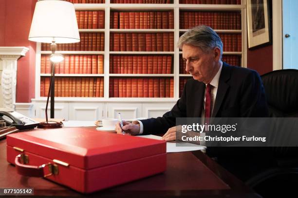 Chancellor of the Exchequer, Philip Hammond, prepares his speech in his office in Downing Street ahead of his 2017 budget announcement tomorrow, on...