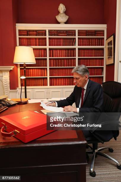 Chancellor of the Exchequer, Philip Hammond, prepares his speech in his office in Downing Street ahead of his 2017 budget announcement tomorrow, on...