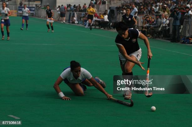 Women hockey players of Italy and Azerbaijan players in action during Lal Bahadur Shastri four nation hockey tournament at Shivaji stadium in New...