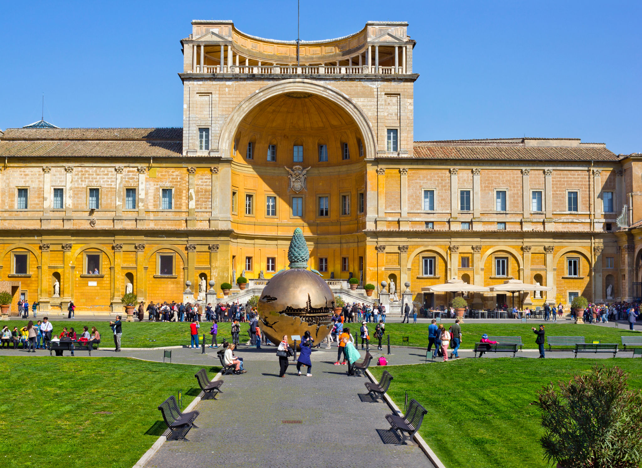 Courtyard of Vatican Museum with many people around Courtyard of Vatican Museum with many people around