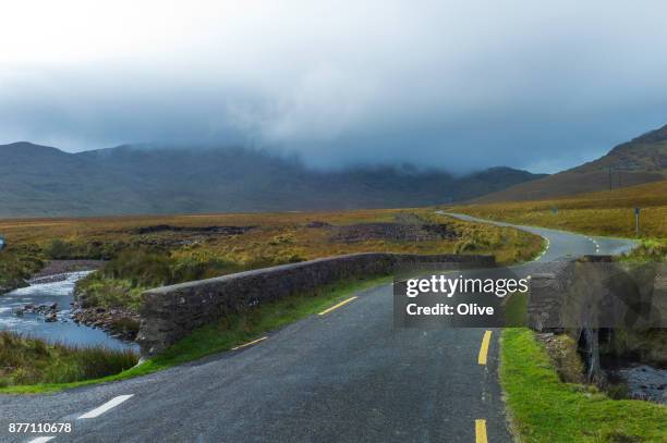 on the road to conor pass, dingle bay, - connor pass stock pictures, royalty-free photos & images