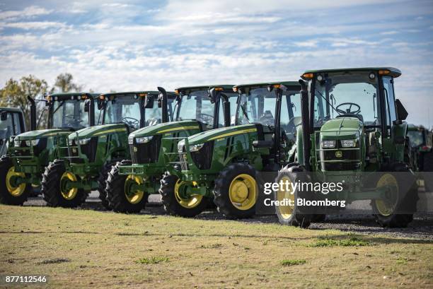 Deere & Co. John Deere tractors sit on display at a United Ag & Turf dealership in Waco, Texas, U.S., on Monday, Nov. 20, 2017. Deere & Co. Is...