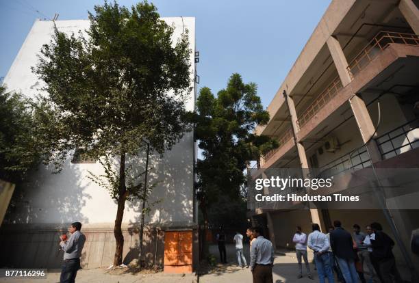 Crowds gather out side the building where shootout took place near Dwarka Morh Metro Station in the morning on November 21, 2017 in New Delhi, India....