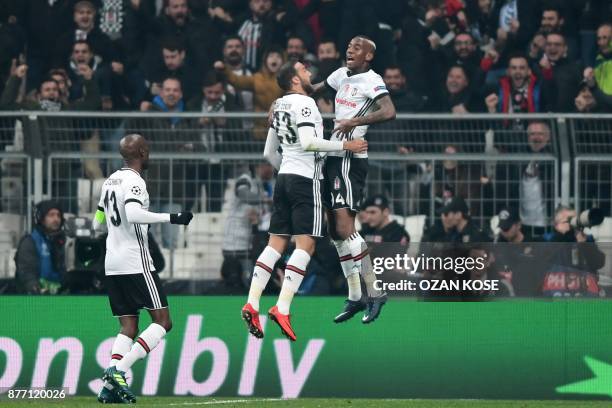 Besiktas' midfielder Talisca celebrates with teammates after scoring a goal during the UEFA Champions League Group G football match between Besiktas...