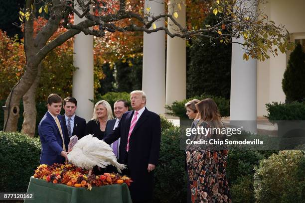 President Donald Trump , first lady Melania Trump and their son Barron participate in a ceremony to pardon the National Thanksgiving Turkey with...