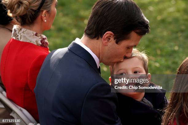 Jared Kushner, senior advisor and son-in-law to U.S. President Donald Trump, kisses his son Joseph Kushner before the pardoning ceremony for the...