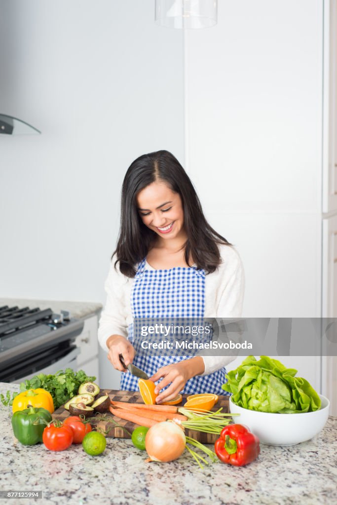 Young Hispanic Women Preparing a Meal