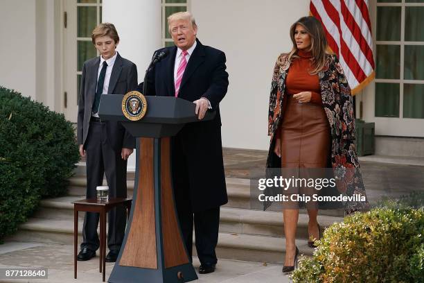 President Donald Trump delivers remarks with his son Barron Trump and first lady Melania Trump before pardoning the National Thanksgiving Turkey in...