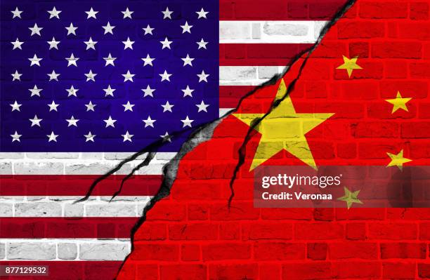 usa and china flag, conflict concept - cracked wall stock illustrations