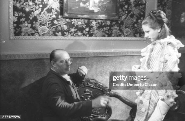 Italian film director Roberto Rossellini directing actress Sandra Milo during the movie 'General della Rovere' 1959.