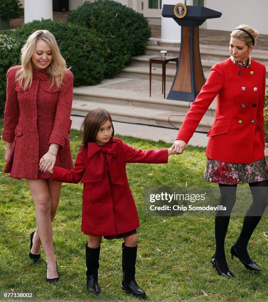 President Donald Trump's daughters Tiffany Trump and Ivanka Trump and her daughter Arabella Kushner leave the Rose Garden after the pardoning...