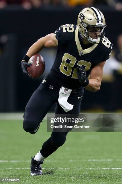 Coby Fleener of the New Orleans Saints runs the ball after a catch during a NFL game against the Washington Redskins at the Mercedes-Benz Superdome...