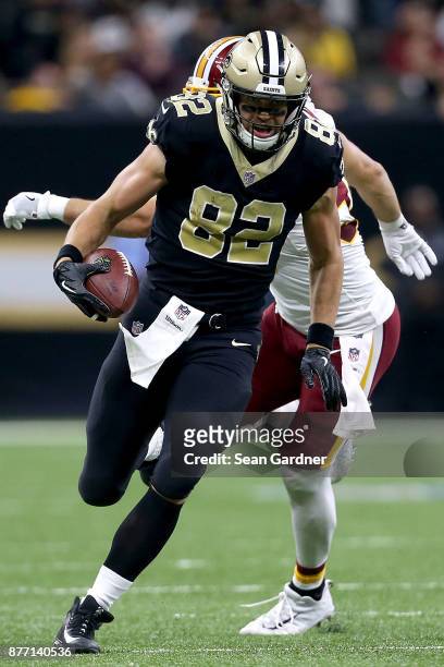 Coby Fleener of the New Orleans Saints runs the ball after a catch during a NFL game against the Washington Redskins at the Mercedes-Benz Superdome...