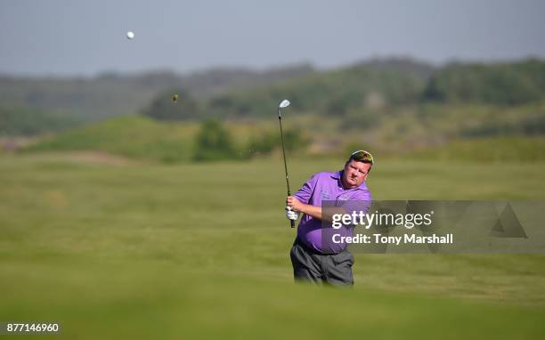 Kevin Saunders of Brokenhurst Manor Golf Club chips on tothe 18th green during Day One of the SkyCaddie PGA Pro-Captain Challenge Grand Final at...