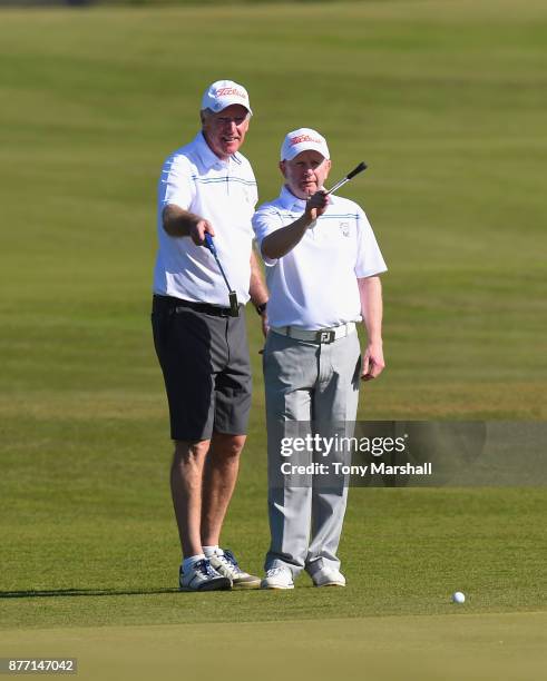 Andrew Baguley of Leigh Golf Club and John Taylor, Captain of Leigh Golf Club line up a putt on the 16th green during Day One of the SkyCaddie PGA...