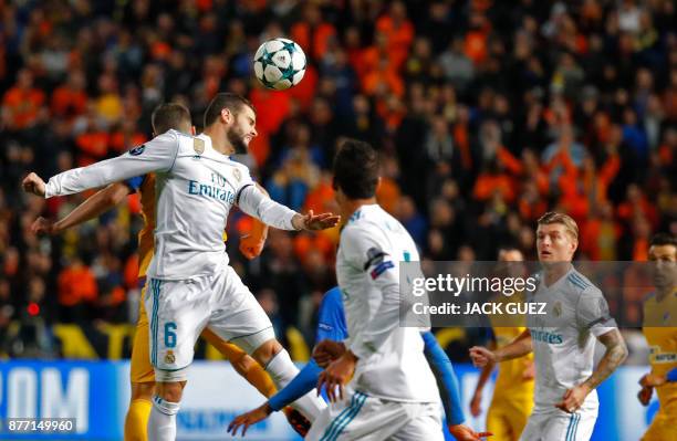 Real Madrid's Spanish defender Nacho heads the ball during the UEFA Champions League Group H match between Apoel FC and Real Madrid on November 21 in...