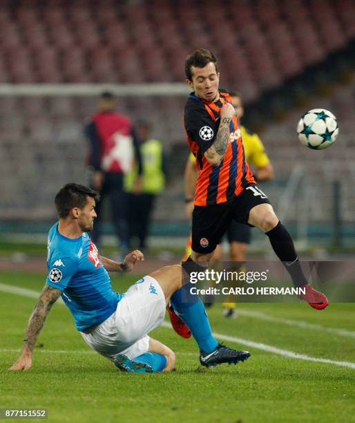 Napoli's midfielder from Italy Christian Maggio fights for the ball with Shakhtar Donetsk's Brazilian midfielder Bernard during the UEFA Champions...