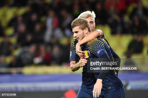 Leipzig's German forward Timo Werner celebrates with teammate after scoring a goal during the UEFA Champions League group G football match between...