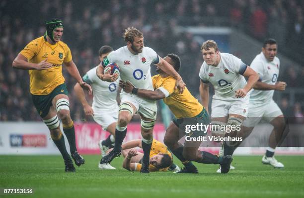 Chris Robshaw of England is tackled by Samu Kerevi of Australia during the Old Mutual Wealth Series autumn international match between England and...