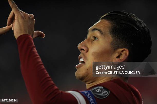 Liverpool's Brazilian midfielder Roberto Firmino celebrates after scoring a goal on November 21, 2017 at the Ramon Sanchez Pizjuan stadium in Sevilla...