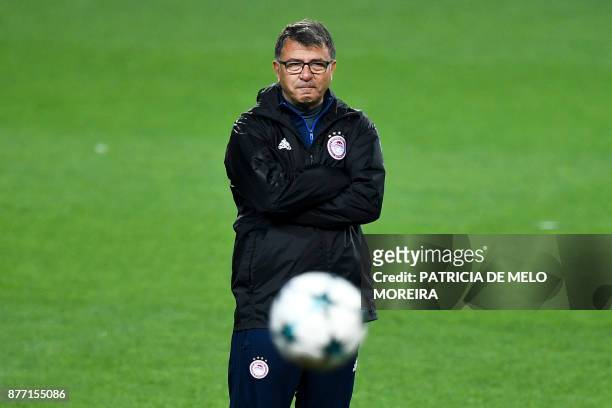 Olympiacos' head coach Takis Lemonis attends a training session at Alvalade stadium in Lisbon on November 21, 2017 on the eve of the UEFA Champions...
