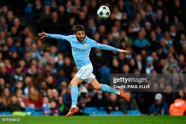 Manchester City's Portuguese midfielder Bernardo Silva heads the ball during the UEFA Champions League Group F football match between Manchester City...