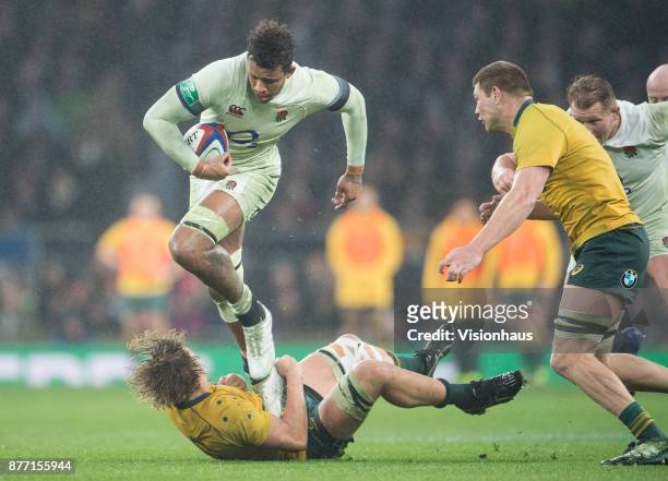 Courtney Lawes of England is tackled by Ned Hanigan of Australia during the Old Mutual Wealth Series autumn international match between England and...